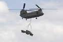 Royal Air Force Boeing CH-47 Chinook carrying Land Rover and trailer at RAF Waddington Air Show 2010